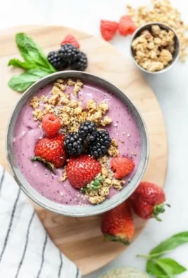 Colorful Berry Smoothie Bowl topped with fresh fruits and granola