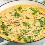 Creamy Tuscan Marry Me Chickpeas dish served in a bowl with herbs