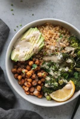 Crispy quinoa chickpea bowl with roasted broccoli and Meyer lemon tahini sauce