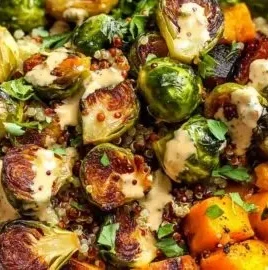 Colorful quinoa power bowls topped with fresh vegetables and dressing