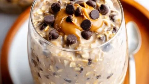 Bowl of dreamy peanut butter chocolate chip overnight oats with chocolate chips on top