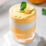 Delicious easy 3 ingredient mango mousse dessert in a glass.