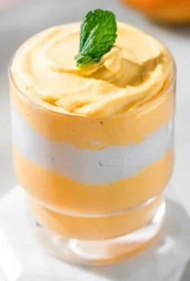 Delicious easy 3 ingredient mango mousse dessert in a glass.