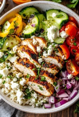 Delicious Greek Chicken Bowl with fresh vegetables and tzatziki sauce