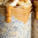 Bowl of high-protein overnight oats topped with fruits and nuts