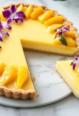 Delicious Mango Curd Tart with a golden crust and fresh mango topping