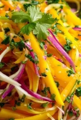 Colorful Mango Slaw salad with fresh ingredients and vibrant dressing