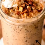 Bowl of Pumpkin Overnight Oats topped with pumpkin seeds and spices