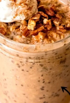 Bowl of Pumpkin Overnight Oats topped with pumpkin seeds and spices