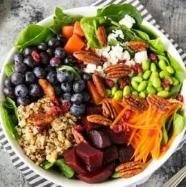 Quinoa, spinach, and blueberry superfood bowl full of nutrients