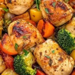 Roasted garlic chicken served with fresh vegetables on a plate