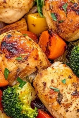 Roasted garlic chicken served with fresh vegetables on a plate