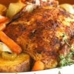 Slow cooker roast chicken with mixed vegetables ready to serve.