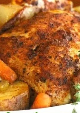 Slow cooker roast chicken with mixed vegetables ready to serve.