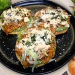 Delicious Chicken Tinga Tostadas topped with fresh ingredients and vibrant flavors.