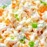 Bowl of classic Hawaiian macaroni salad with vegetables and dressing