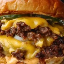 Crispy smash burger with lacy edges and secret sauce on a plate