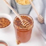 Easy homemade hot honey in a jar with chili peppers
