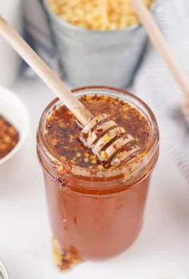Easy homemade hot honey in a jar with chili peppers
