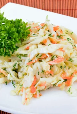 Bowl of easy vinegar coleslaw with colorful shredded vegetables