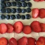 Flag Fruit Sugar Cookie Crust Pizza topped with colorful fruits