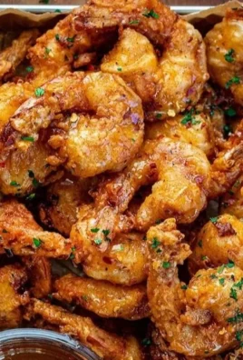 Delicious hot honey fried shrimp served on a plate with garnish