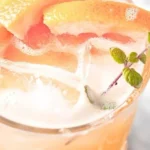 Delicious Paloma Mocktail with grapefruit and lime garnish in a glass