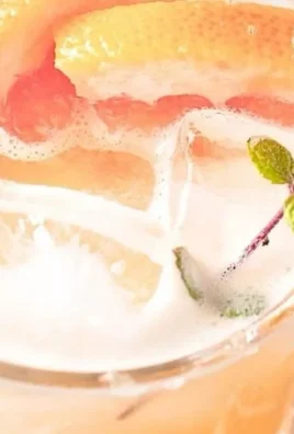 Delicious Paloma Mocktail with grapefruit and lime garnish in a glass