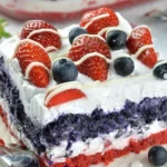 Patriotic Dessert Lasagna layered with red, white, and blue ingredients