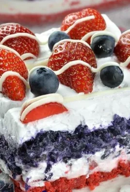 Patriotic Dessert Lasagna layered with red, white, and blue ingredients