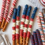 Patriotic pretzel rods decorated with red, white, and blue colors for celebrations.