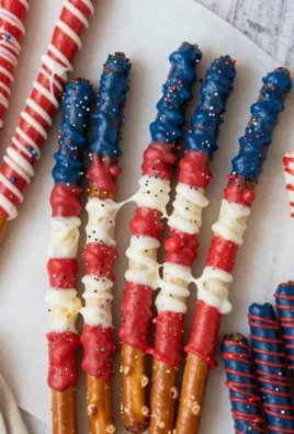 Patriotic pretzel rods decorated with red, white, and blue colors for celebrations.