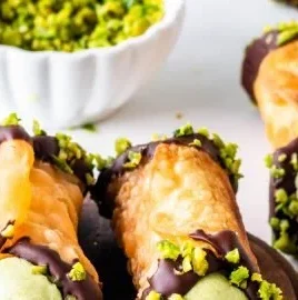 Delicious homemade Pistachio Cannoli topped with chopped pistachios