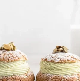 Pistachio Cream Puffs filled with creamy pistachio filling on a plate