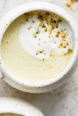 Homemade pistachio latte in a stylish coffee cup