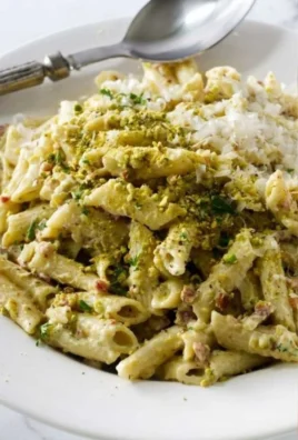 Delicious Pistachio Pasta served with fresh herbs and parmesan cheese