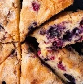 Festive Red White and Blue Berry Cake decorated with fresh berries.