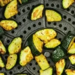 Crispy air fryer zucchini slices served on a plate