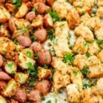 Delicious Baked Garlic Parmesan Chicken served with roasted potatoes