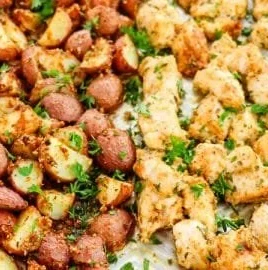 Delicious Baked Garlic Parmesan Chicken served with roasted potatoes