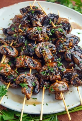 Delicious balsamic garlic grilled mushroom skewers ready for grilling.