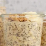 A bowl of brown sugar overnight oats topped with fresh fruit and nuts.