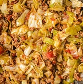 Cabbage and ground beef dish served on a plate, showcasing a savory meal.
