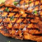 Plate of Catalina Grilled Chicken garnished with herbs and spices