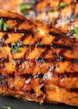 Plate of Catalina Grilled Chicken garnished with herbs and spices