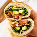 Healthy cottage cheese wrap with fresh vegetables and herbs
