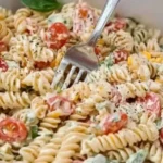 Creamy Italian Pasta Salad with fresh vegetables and herbs