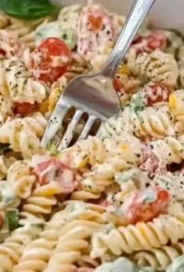 Creamy Italian Pasta Salad with fresh vegetables and herbs