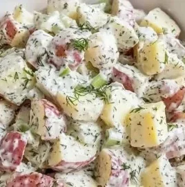 Creamy red potato salad served in a bowl, perfect for summer gatherings.