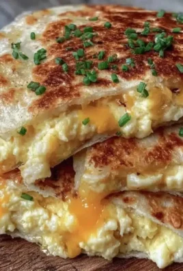 Crispy egg and cheese breakfast quesadillas served on a plate